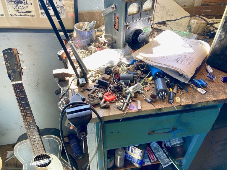 Tools and electronics on a repair workbench