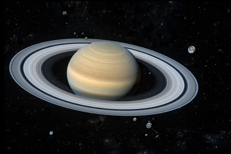 Saturn and its rings photographed against black space with distant moons